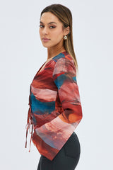 Multi Abstract Top Long Sleeve V-Neck Tie Front